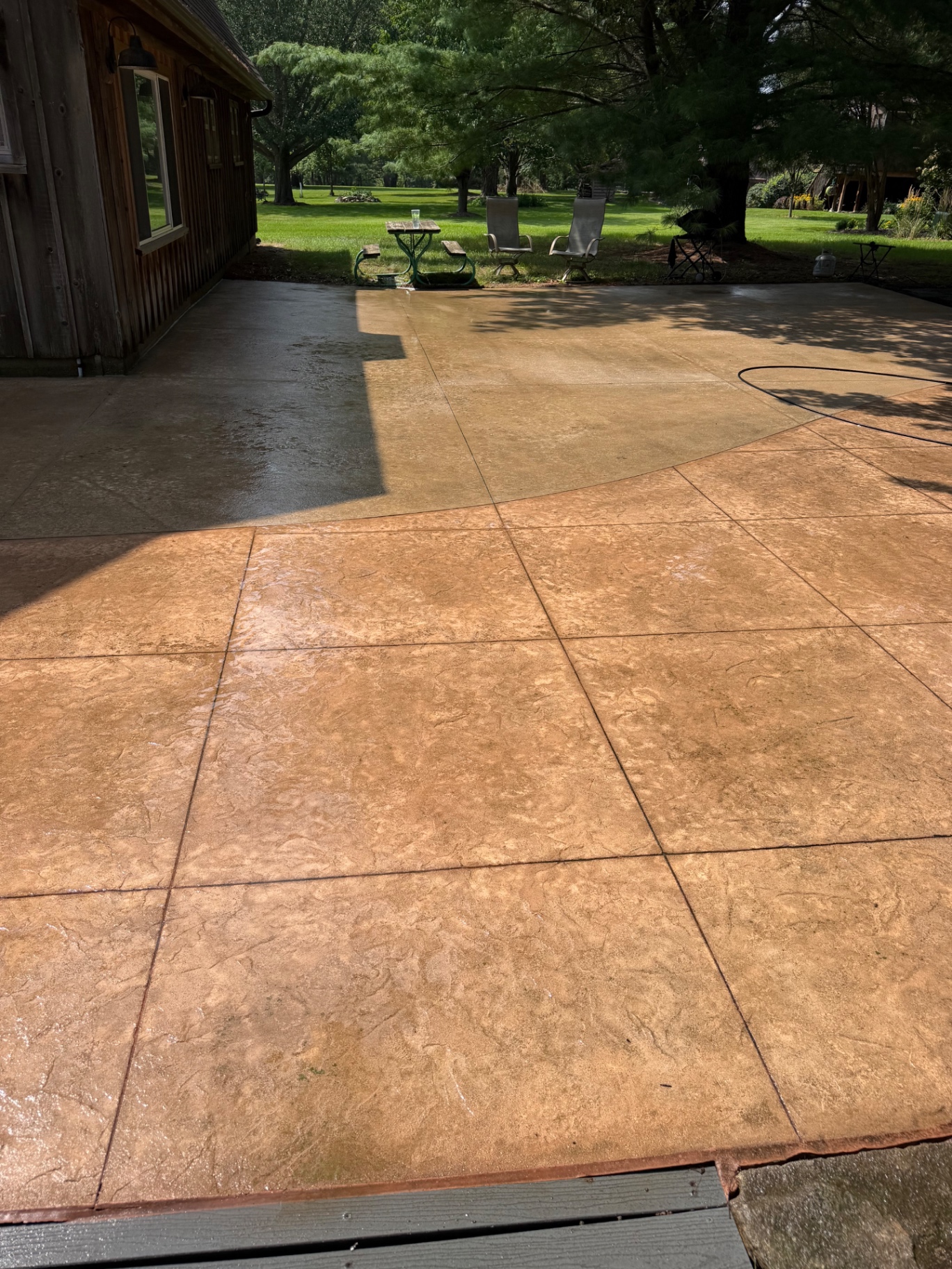 Stamped concrete patio following professional washing